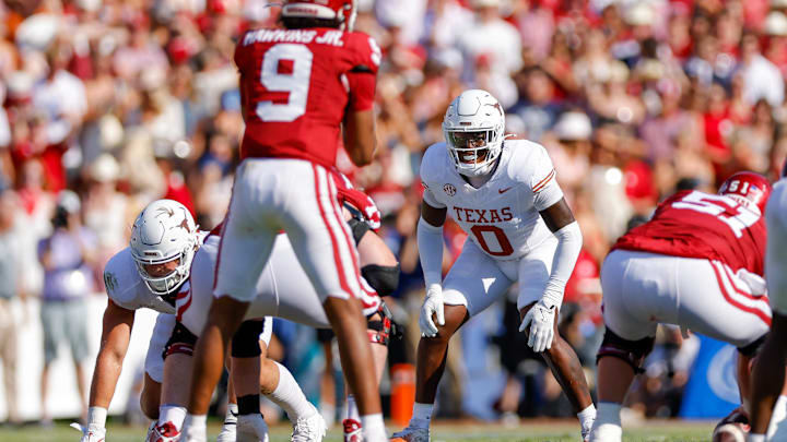 Oct 12, 2024; Dallas, Texas, USA; Texas Longhorns linebacker Anthony Hill Jr. (0) peers over the lined at Oklahoma Sooners quarterback Michael Hawkins Jr. (9) during the second quarter at the Cotton Bowl. Mandatory Credit: Andrew Dieb-Imagn Images