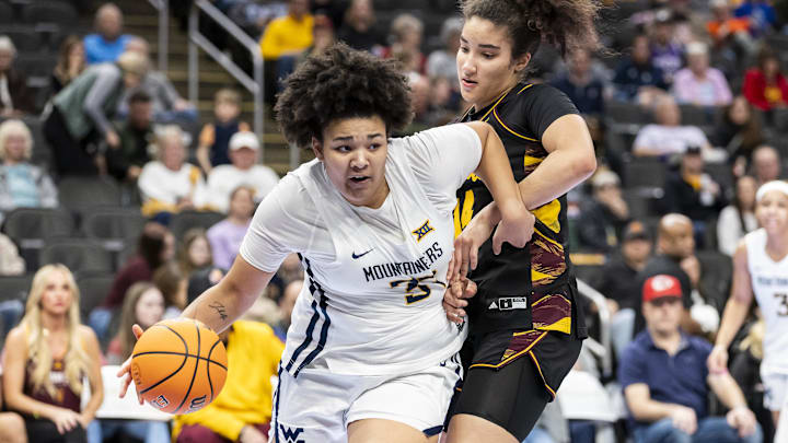 Mar 6, 2026; Kansas City, MO, USA;West Virginia forward Celia Riviere (37) attempts to maneuver past Arizona State forward Heloisa Carrera (14) during the first half at T-Mobile Center. Mandatory Credit: Nick Tre. Smith-Imagn Images
