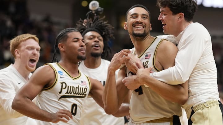 Purdue Boilermakers forward Trey Kaufman-Renn (4) is congratulated by his teammates. Purdue Boilermakers forward Trey Kaufman-Renn (4) is congratulated by his teammates.