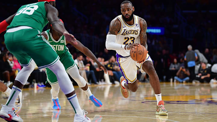 Dec 25, 2023; Los Angeles, California, USA; Los Angeles Lakers forward LeBron James (23) moves to the basket against Boston Celtics center Neemias Queta (88) and guard Jrue Holiday (4) during the first half at Crypto.com Arena. Mandatory Credit: Gary A. Vasquez-Imagn Images Dec 25, 2023; Los Angeles, California, USA; Los Angeles Lakers forward LeBron James (23) moves to the basket against Boston Celtics center Neemias Queta (88) and guard Jrue Holiday (4) during the first half at Crypto.com Arena. Mandatory Credit: Gary A. Vasquez-Imagn Images