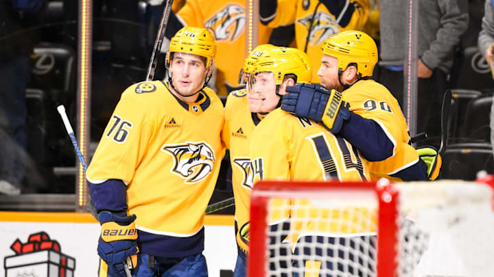 Dec 21, 2024; Nashville, Tennessee, USA;  Nashville Predators left wing Zachary L'Heureux (68) celebrates his goal with his teammates  against the Los Angeles Kings during the first period at Bridgestone Arena. Mandatory Credit: Steve Roberts-Imagn Images