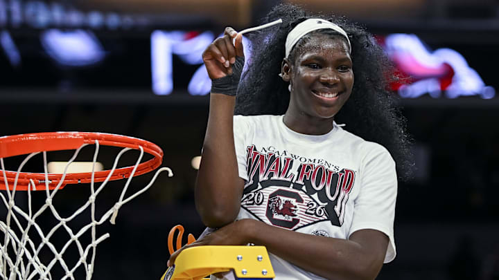 Mar 30, 2026; Sacramento, CA, USA;  South Carolina Gamecocks center Madina Okot (11) cuts the nets after defeating the Texas Christian University Horned Frogs in an Elite Eight game in the Sacramento Regional 4 of the women's 2026 NCAA Tournament at the Golden 1 Center. Mandatory Credit: Ed Szczepanski-Imagn Images