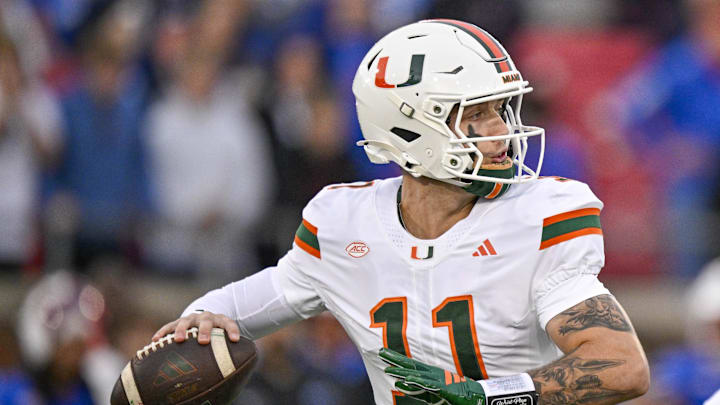 Nov 1, 2025; Dallas, Texas, USA;  Miami Hurricanes quarterback Carson Beck (11) throws the ball during the game between the Mustangs and the Hurricanes at Gerald J. Ford Stadium. Mandatory Credit: Jerome Miron-Imagn Images