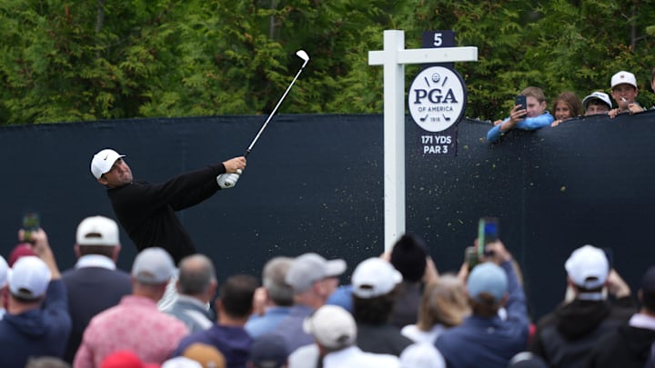 Scottie Scheffler is in contention in his PGA Championship title defense after negotiating a tough Aronimink on Friday.
