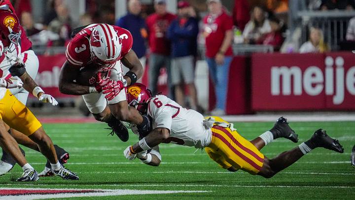 USC Trojans safety Christian Pierce (6) tackles Wisconsin Badgers running back Abu Sama III (3) during their game Oct. 24, 2026, at Camp Randall Stadium in Madison, Wisconsin.