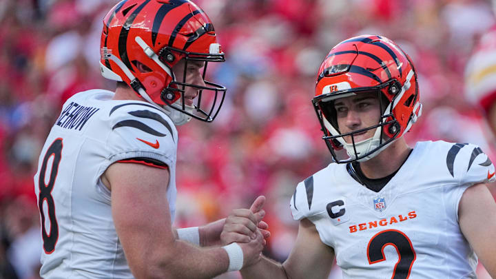 Sep 15, 2024; Kansas City, Missouri, USA; Cincinnati Bengals place kicker Evan McPherson (2) celebrates with punter Ryan Rehkow (8) after kicking a field goal against the Kansas City Chiefs during the game at GEHA Field at Arrowhead Stadium. Mandatory Credit: Denny Medley-Imagn Images