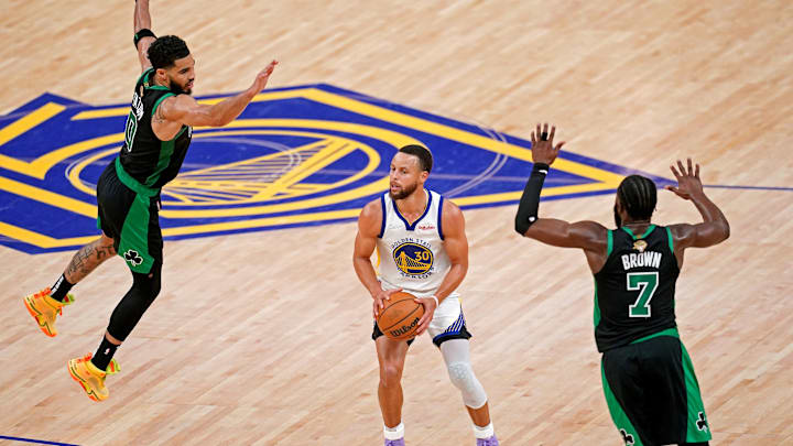 Golden State Warriors guard Stephen Curry (30) shoots the ball against Boston Celtics forward Jayson Tatum (0) and guard Jaylen Brown (7) during the fourth quarter in game five of the 2022 NBA Finals at Chase Center. Mandatory Credit: Cary Edmondson-Imagn Images