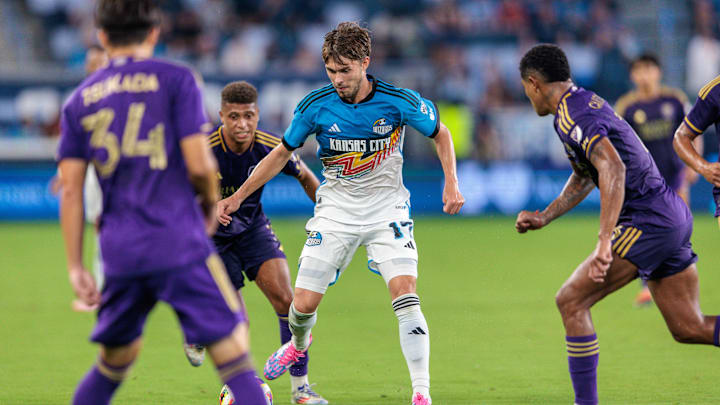 Aug 24, 2024; Kansas City, Kansas, USA; Sporting Kansas City midfielder Jake Davis (17) takes control of the ball during the second half against Orlando City at Children's Mercy Park. Mandatory Credit: William Purnell-USA TODAY Sports