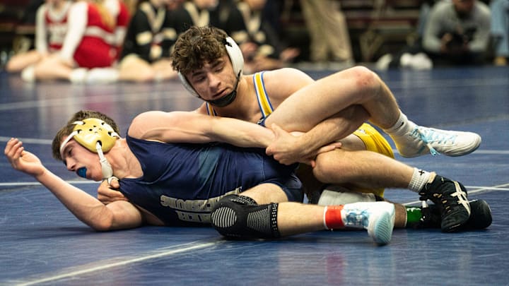 Don Bosco's Dawson Youngblut wrestles Sumner-Fredricksburg's Jase Jones at 144 lbs during the Iowa high school boys state wrestling tournament at Casey's Center on Friday, Feb. 20, 2026 in Des Moines.