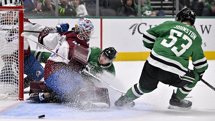Mar 6, 2026; Dallas, Texas, USA; Colorado Avalanche goaltender Scott Wedgewood (41) stops a shot by Dallas Stars defenseman Miro Heiskanen (4) as center Wyatt Johnston (53) looks for the rebound during the second period at the American Airlines Center. Mandatory Credit: Jerome Miron-Imagn Images