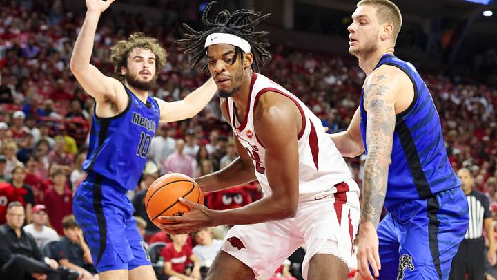 Oct 28, 2026; Fayetteville, Arkansas, USA; Arkansas Razorbacks forward Cooper Bowser (21) drives against Memphis Tigers forward Nemanja Popovic (17) during the second half at Bud Walton Arena. Mandatory Credit: Nelson Chenault-Imagn Images Oct 28, 2026; Fayetteville, Arkansas, USA; Arkansas Razorbacks forward Cooper Bowser (21) drives against Memphis Tigers forward Nemanja Popovic (17) during the second half at Bud Walton Arena. Mandatory Credit: Nelson Chenault-Imagn Images