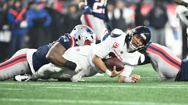 Jan 18, 2026; Foxborough, MA, USA; Houston Texans quarterback C.J. Stroud (7) is sacked in the second quarter against the New England Patriots in an AFC Divisional Round game at Gillette Stadium. Mandatory Credit: Brian Fluharty-Imagn Images