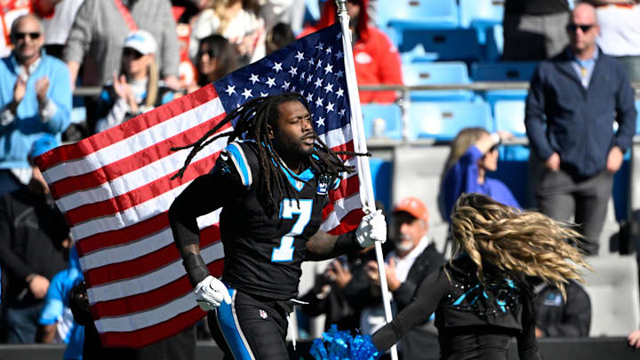 Nov 24, 2024; Charlotte, North Carolina, USA;  Carolina Panthers linebacker Jadeveon Clowney (7) runs on to the field before the game at Bank of America Stadium. Mandatory Credit: Bob Donnan-Imagn Images