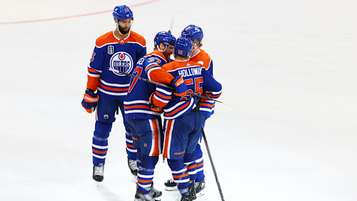 Jun 15, 2024; Edmonton, Alberta, CAN; Edmonton Oilers left wing Dylan Holloway (55) celebrates goal with teammates in the third period against the Florida Panthers  in game four of the 2024 Stanley Cup Final at Rogers Place. Mandatory Credit: Sergei Belski-Imagn Images