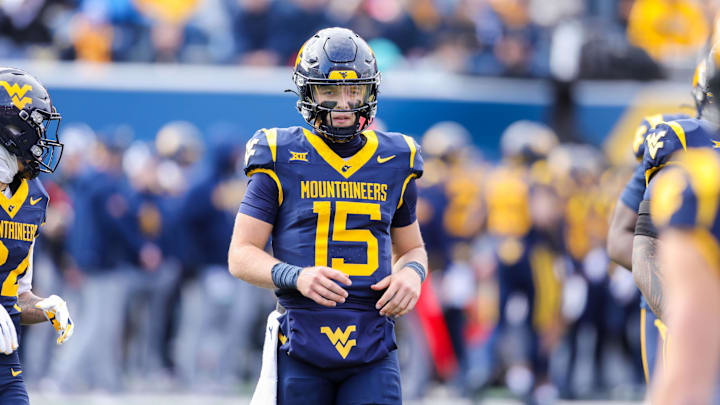 Nov 29, 2025; Morgantown, West Virginia, USA; West Virginia Mountaineers quarterback Scotty Fox Jr. (15) on the field during the second quarter against the Texas Tech Red Raiders at Milan Puskar Stadium. Mandatory Credit: Ben Queen-Imagn Images