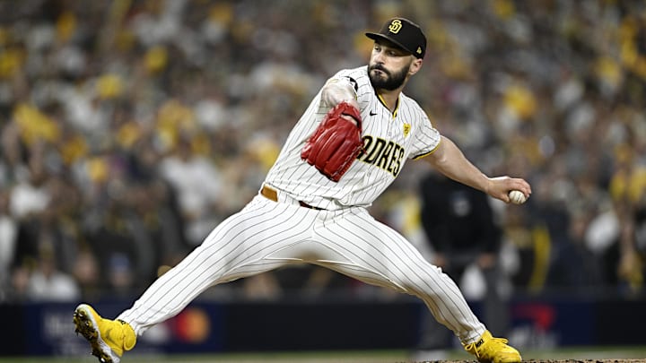 Oct 8, 2024; San Diego, California, USA; San Diego Padres pitcher Tanner Scott (66) throws in the eighth inning against the Los Angeles Dodgers during game three of the NLDS for the 2024 MLB Playoffs at Petco Park.  Mandatory Credit: Denis Poroy-Imagn Images