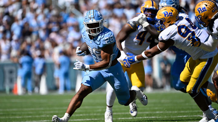 Omarion Hampton eludes Pitt tacklers in a North Carolina game last season. Hampton is generally recognized as back No. 2 in the draft. Omarion Hampton eludes Pitt tacklers in a North Carolina game last season. Hampton is generally recognized as back No. 2 in the draft.