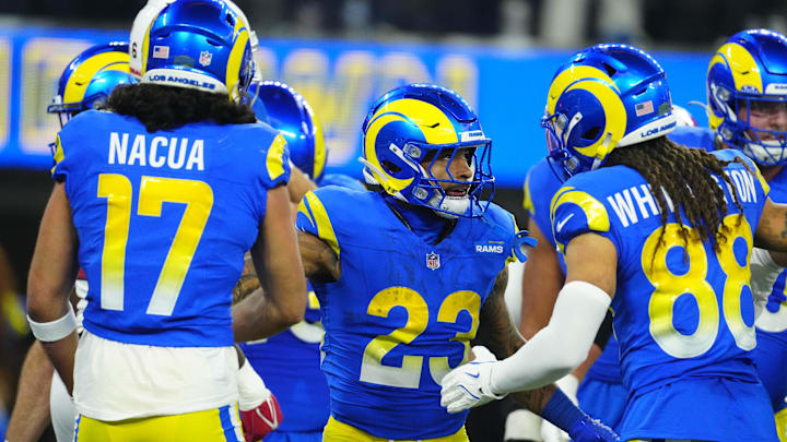 Dec 28, 2024; Inglewood, California, USA; Los Angeles Rams running back Kyren Williams (23) celebrates with wide receiver Jordan Whittington (88) and wide receiver Puka Nacua (17) after scoring on a 1-yard touchdown run against the Arizona Cardinals in the first half at SoFi Stadium. Mandatory Credit: Kirby Lee-Imagn Images