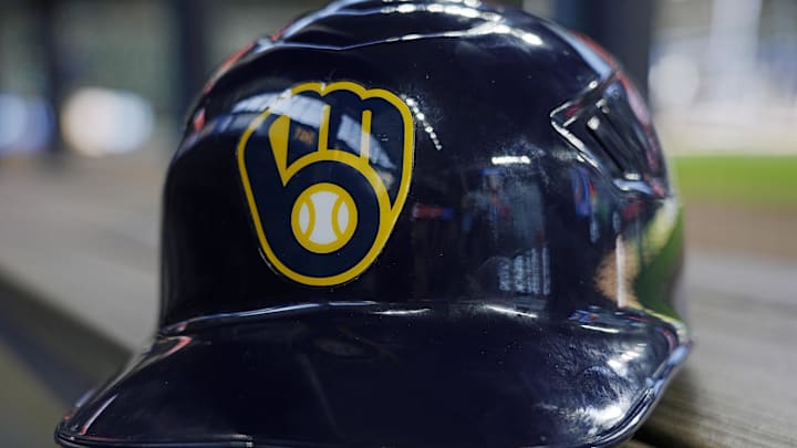Jun 10, 2024; Milwaukee, Wisconsin, USA;  A Milwaukee Brewers batting helmet sits on the bench during batting practice prior to the game against the Toronto Blue Jays at American Family Field. Mandatory Credit: Jeff Hanisch-Imagn Images