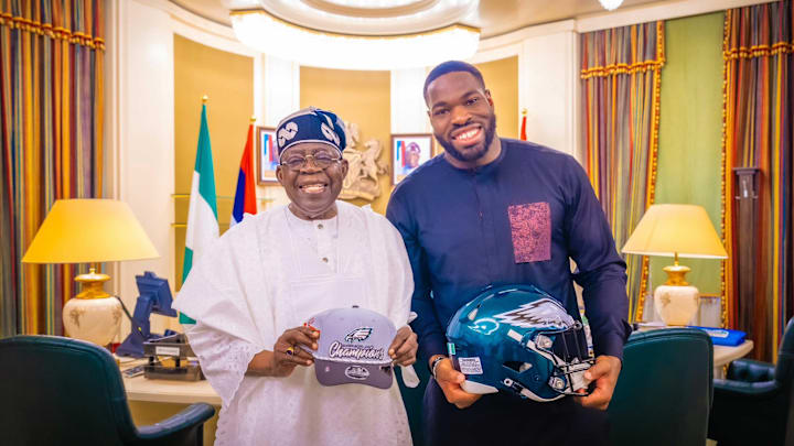 Eagles DT Moro Ojomo meets Nigerian President Bola Ahmed Tinubu. Eagles DT Moro Ojomo meets Nigerian President Bola Ahmed Tinubu.