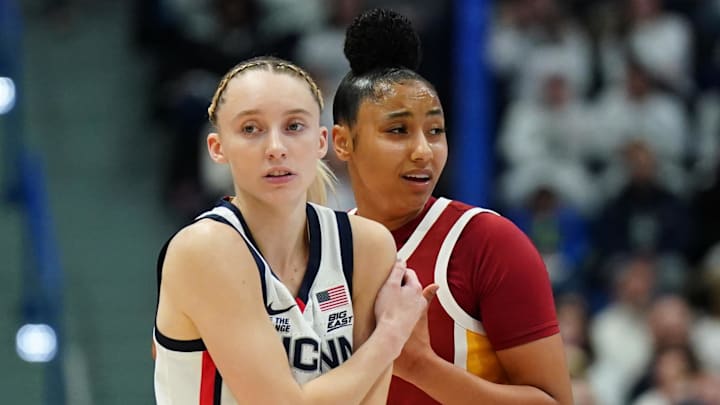 Dec 21, 2024; Hartford, Connecticut, USA; UConn Huskies guard Paige Bueckers (5) and USC Trojans guard JuJu Watkins (12) on the court in the first half at XL Center. Mandatory Credit: David Butler II-Imagn Images Dec 21, 2024; Hartford, Connecticut, USA; UConn Huskies guard Paige Bueckers (5) and USC Trojans guard JuJu Watkins (12) on the court in the first half at XL Center. Mandatory Credit: David Butler II-Imagn Images
