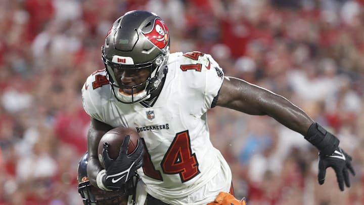 Oct 24, 2021; Tampa, Florida, USA; Tampa Bay Buccaneers wide receiver Chris Godwin (14) runs with the ball asChicago Bears free safety Eddie Jackson (4) defends during the second half at Raymond James Stadium. Mandatory Credit: Kim Klement-Imagn Images