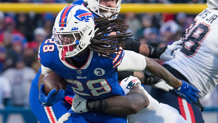 Jan 8, 2023; Orchard Park, New York, USA; Buffalo Bills running back James Cook (28) carries the