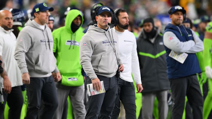 Dec 15, 2024; Seattle, Washington, USA; Seattle Seahawks head coach Mike Macdonald watches a replay after Green Bay scored a touchdown during the first half at Lumen Field. 