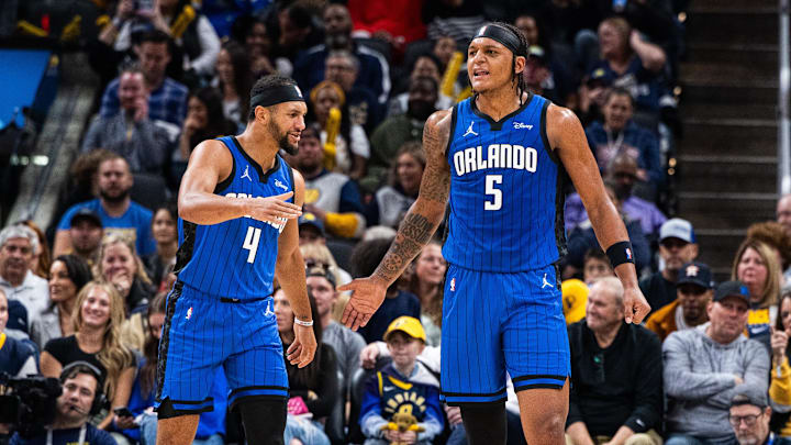Nov 19, 2023; Indianapolis, Indiana, USA; Orlando Magic forward Paolo Banchero (5)  celebrates his made slam dunk with  guard Jalen Suggs (4) in the first half against the Indiana Pacers at Gainbridge Fieldhouse. Mandatory Credit: Trevor Ruszkowski-Imagn Images
