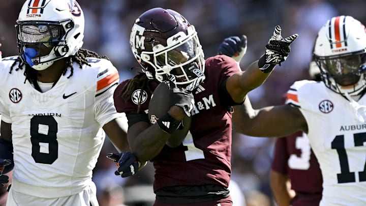 Texas A&M Aggies wide receiver Mario Craver (1) motions against the Auburn Tigers during the first half at Kyle Field. Texas A&M Aggies wide receiver Mario Craver (1) motions against the Auburn Tigers during the first half at Kyle Field.