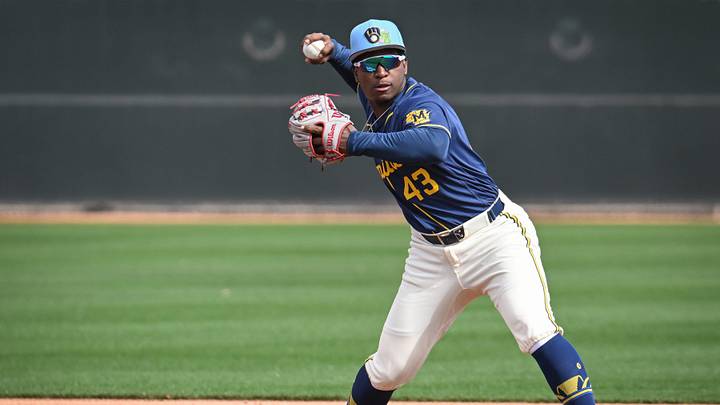 Milwaukee Brewers infield prospect Luis Pena throws to first in a double-play drill during spring training workouts Sunday, February 15, 2026, at American Family Fields of Phoenix in Phoenix, Arizona.