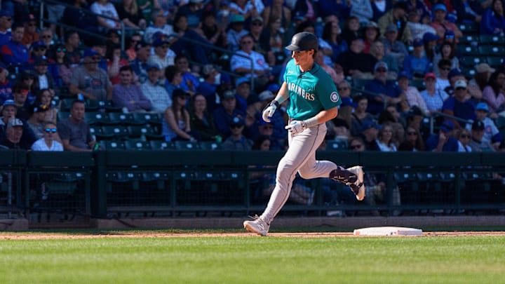 Mar 8, 2025; Mesa, Arizona, USA; Seattle Mariners infielder Colt Emerson (85) hits a home run in the top of the ninth during a spring training game against the Chicago Cubs at Sloan Park. Mandatory Credit: Allan Henry-Imagn Images