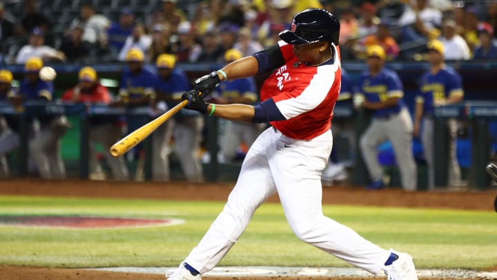 Mar 13, 2023; Phoenix, Arizona, USA; Great Britain batter BJ Murray Jr. hits a sacrifice fly to bring in a run in the fourth inning against Colombia during the World Baseball Classic at Chase Field. 