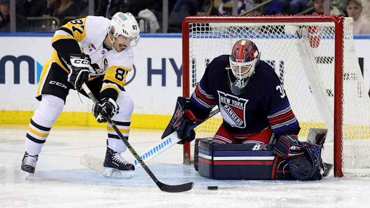 Dec 6, 2024; New York, New York, USA; New York Rangers goaltender Igor Shesterkin (31) makes a save against Pittsburgh Penguins center Sidney Crosby (87) during the second period at Madison Square Garden. Mandatory Credit: Brad Penner-Imagn Images