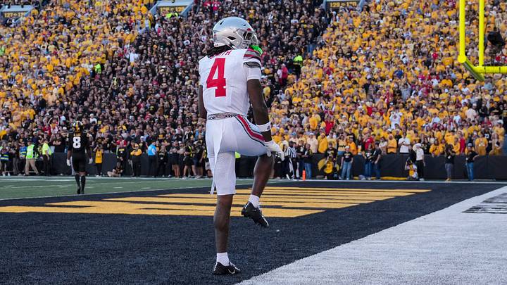 Ohio State Buckeyes wide receiver Jeremiah Smith (4) strikes a Heisman pose after catching a touchdown pass, breaking the school record, during the NCAA football game against the Iowa Hawkeyes at Kinnick Stadium in Iowa City on Oct. 3, 2026. Ohio State Buckeyes wide receiver Jeremiah Smith (4) strikes a Heisman pose after catching a touchdown pass, breaking the school record, during the NCAA football game against the Iowa Hawkeyes at Kinnick Stadium in Iowa City on Oct. 3, 2026.