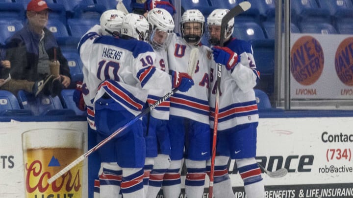 Feb 7, 2024; Plymouth, MI, USA; USA s Cole Eiserman (34) celebrates his goal against Finland with teammates during the second period of the 2024 U18 s Five Nations Tournament at USA Hockey Arena. Mandatory Credit: David Reginek-Imagn Images