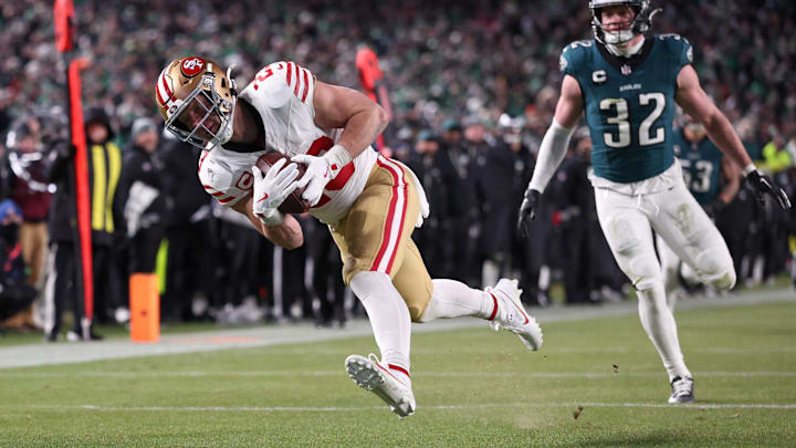 Jan 11, 2026; Philadelphia, PA, USA; San Francisco 49ers running back Christian McCaffrey (23) makes a catch for a touchdown defended by Philadelphia Eagles safety Reed Blankenship (32) during the fourth quarter in an NFC Wild Card Round game at Lincoln Financial Field. Mandatory Credit: Bill Streicher-Imagn Images Jan 11, 2026; Philadelphia, PA, USA; San Francisco 49ers running back Christian McCaffrey (23) makes a catch for a touchdown defended by Philadelphia Eagles safety Reed Blankenship (32) during the fourth quarter in an NFC Wild Card Round game at Lincoln Financial Field. Mandatory Credit: Bill Streicher-Imagn Images
