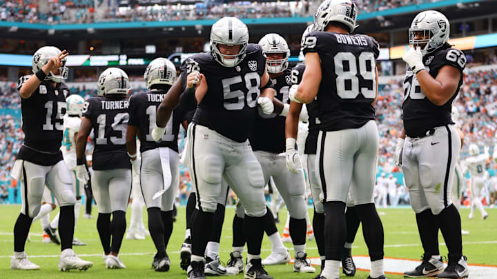 Nov 17, 2024; Miami Gardens, Florida, USA; Las Vegas Raiders tight end Brock Bowers (89) celebrates with guard Jackson Powers-Johnson (58) after scoring a touchdown against the Miami Dolphins during the third quarter at Hard Rock Stadium. Mandatory Credit: Sam Navarro-Imagn Images