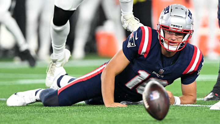 Aug 15, 2024; Foxborough, Massachusetts, USA; New England Patriots quarterback Drake Maye (10) fumbles the ball against the Philadelphia Eagles during the second half at Gillette Stadium. Mandatory Credit: Brian Fluharty-USA TODAY Sports