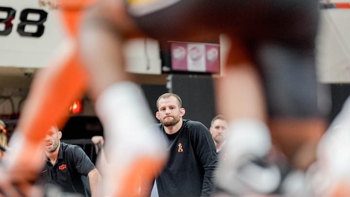 Oklahoma State’s head coach David Taylor stands on the side of the mat during an NCAA wrestling meet between Oklahoma State and Missouri at Gallagher-Iba Arena in Stillwater, Okla., on Sunday, Feb. 2, 2025.