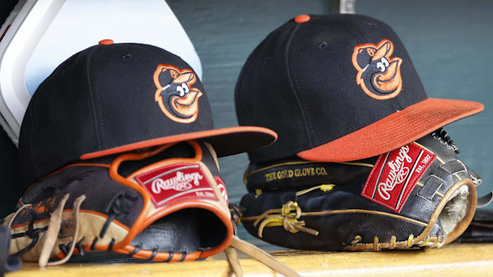 Apr 27, 2023; Detroit, Michigan, USA; Baltimore Orioles hats and glove sits in dugout in the second inning against the Detroit Tigers at Comerica Park. Mandatory Credit: Rick Osentoski-Imagn Images Apr 27, 2023; Detroit, Michigan, USA; Baltimore Orioles hats and glove sits in dugout in the second inning against the Detroit Tigers at Comerica Park. Mandatory Credit: Rick Osentoski-Imagn Images