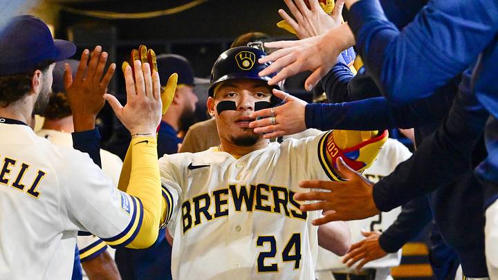 Apr 30, 2026; Milwaukee, Wisconsin, USA;  Milwaukee Brewers catcher William Contreras (24) is greeted in the dugout after hitting a two run home run in the third inning against the Arizona Diamondbacks at American Family Field. Mandatory Credit: Benny Sieu-Imagn Images