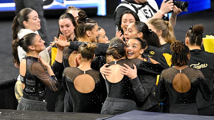 Apr 17, 2025; Fort Worth, TX, USA; The University of Missouri Tiger team celebrate after the announcement of the final team scores during the 2025 Women's National Gymnastics Semifinal at Dickies Arena. Mandatory Credit: Jerome Miron-Imagn Images Apr 17, 2025; Fort Worth, TX, USA; The University of Missouri Tiger team celebrate after the announcement of the final team scores during the 2025 Women's National Gymnastics Semifinal at Dickies Arena. Mandatory Credit: Jerome Miron-Imagn Images