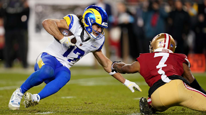 Dec 12, 2024; Santa Clara, California, USA; Los Angeles Rams wide receiver Puka Nacua (17) is tackled by San Francisco 49ers cornerback Charvarius Ward (7) after making a catch for a first down in the fourth quarter at Levi's Stadium. Mandatory Credit: Cary Edmondson-Imagn Images