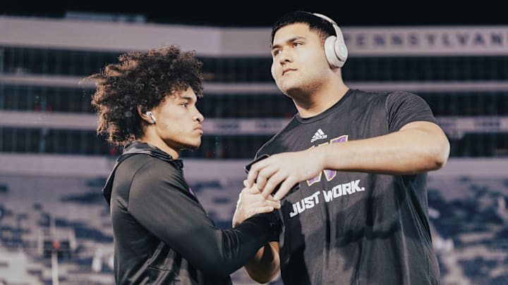 Demond Williams Jr. and offensive tackle Drew Azzopardi share a pregame moment. 