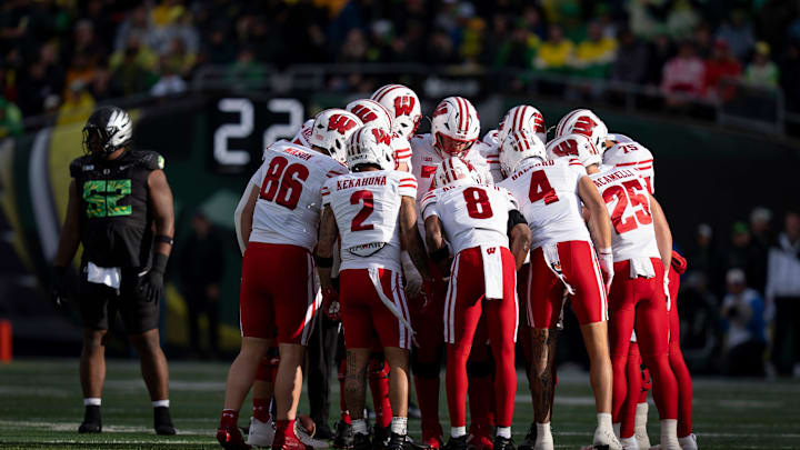 Wisconsin huddles as the Oregon Ducks host the Wisconsin Badgers on Oct. 25, 2025, at Autzen Stadium in Eugene, Oregon.