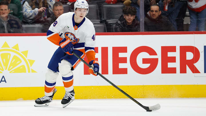 Dec 16, 2025; Detroit, Michigan, USA;  New York Islanders defenseman Matthew Schaefer (48) skates with the puck in the first period against the Detroit Red Wings at Little Caesars Arena. Mandatory Credit: Rick Osentoski-Imagn Images