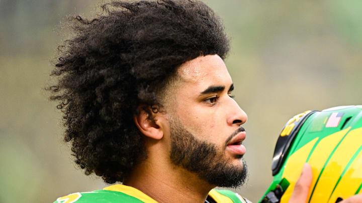 Dec 20, 2025; Eugene, OR, USA; Oregon Ducks quarterback Dante Moore (5) looks on before the game against the James Madison Dukes at Autzen Stadium. Mandatory Credit: Troy Wayrynen-Imagn Images