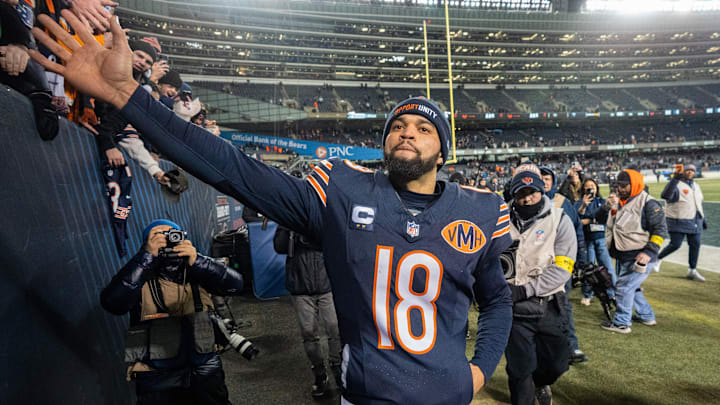 Chicago Bears quarterback Caleb Williams (18) high fives fans after their game Saturday, December 20, 2025 at Soldier Field in Chicago, Illinois. The Chicago Bears beat the Green Bay Packers 22-16 in overtime.