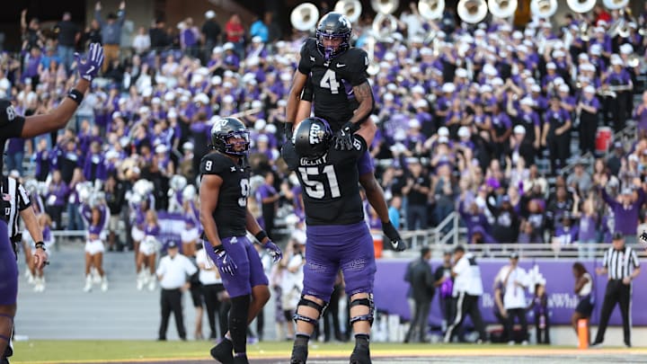 Nov 23, 2024; Fort Worth, Texas, USA; TCU Horned Frogs running back Cam Cook (4) celebrates with offensive lineman Coltin Deery (51) after scoring a touchdown against the Arizona Wildcats in the third quarter at Amon G. Carter Stadium. Mandatory Credit: Tim Heitman-Imagn Images Nov 23, 2024; Fort Worth, Texas, USA; TCU Horned Frogs running back Cam Cook (4) celebrates with offensive lineman Coltin Deery (51) after scoring a touchdown against the Arizona Wildcats in the third quarter at Amon G. Carter Stadium. Mandatory Credit: Tim Heitman-Imagn Images